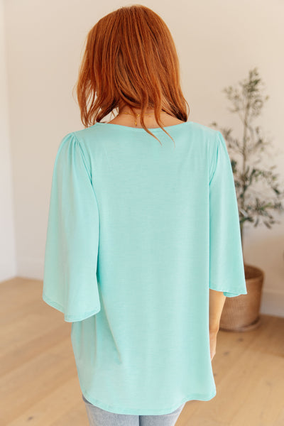 Wrinkle Free Flare Sleeve Top in Neon Blue