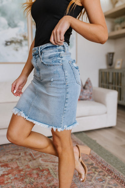 Risen Lightwash Raw Hem Denim Skirt